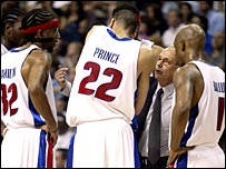 Detroit coach Larry Brown talks to his players during a time out